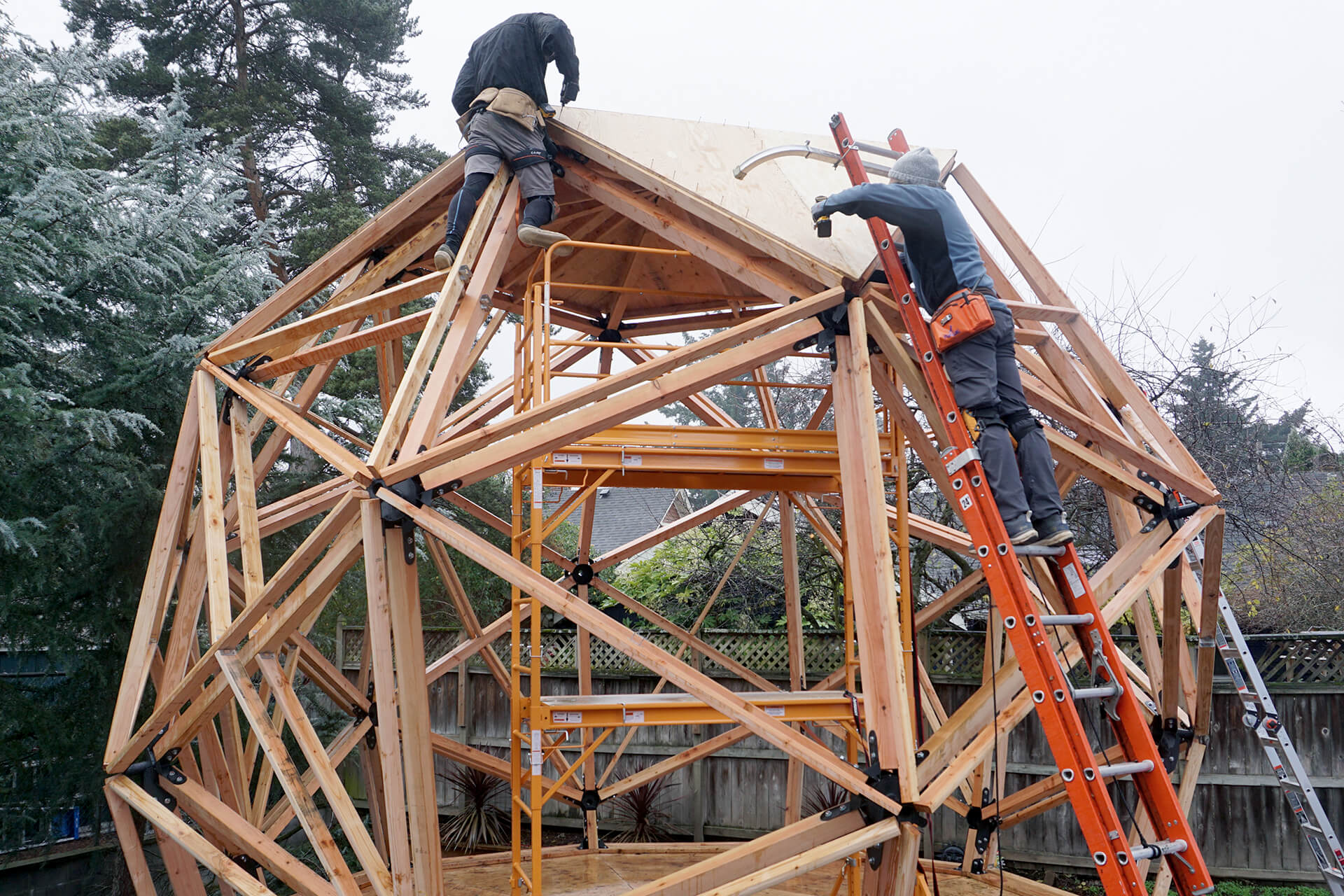 Erecting the geodesic dome structure during framing.